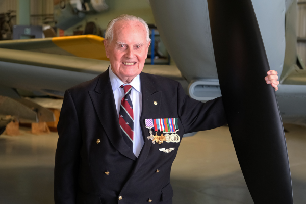 Colin stood with plane