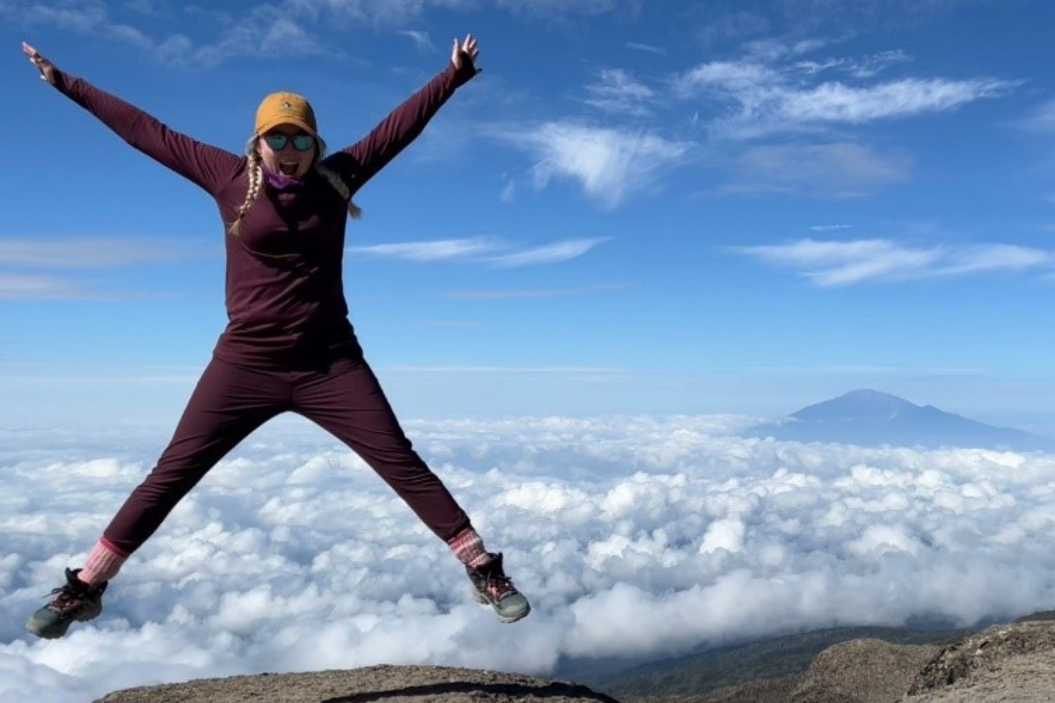 Rowena jumping on top of mountain
