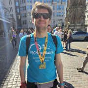 Tom smiling after running London landmarks half marathon