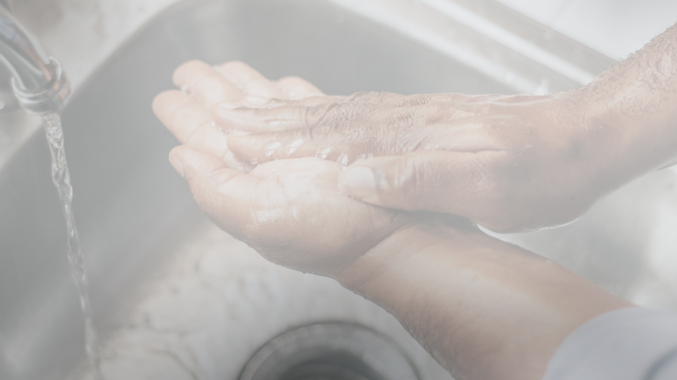 a man washes his hands