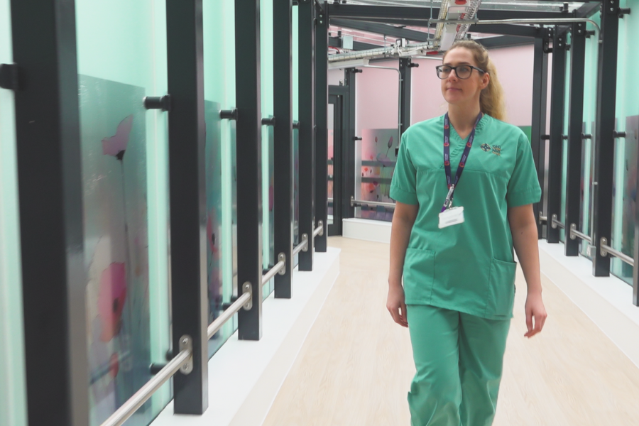Maternity Assistant, Ffion, walking in corridor