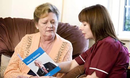 Nurse explaining a condition to a patient