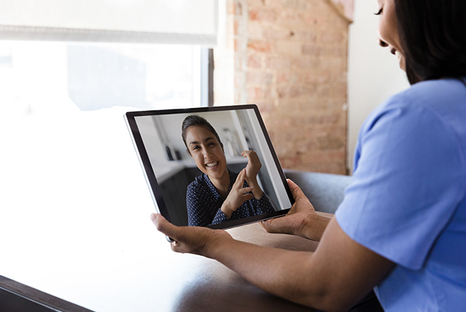 Nurse using a tablet to make a video call