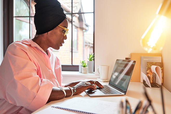 Female nurse working at a laptop