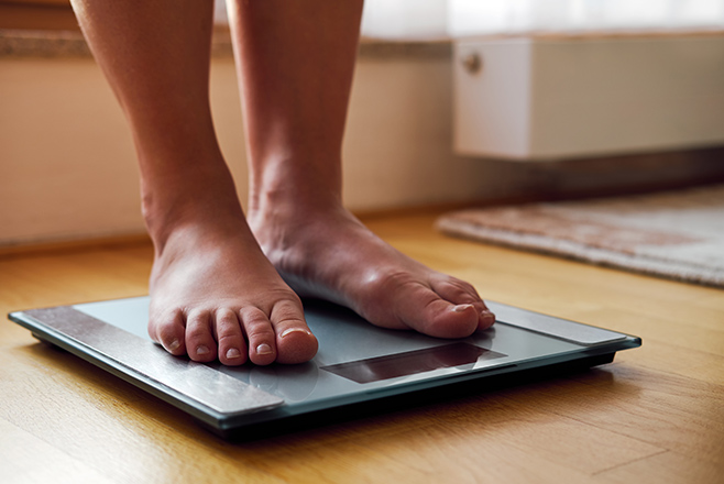 Feet on weighing scales