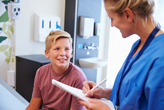 A child talking to a nurse