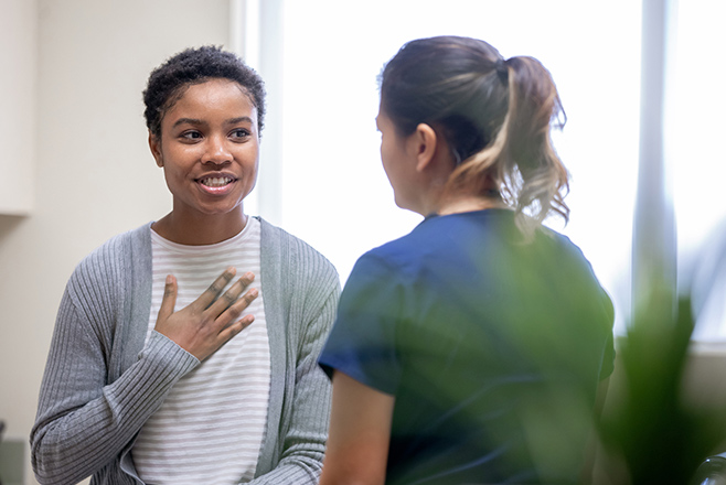 Two women sitting down and talking