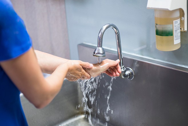 Female nurse washing her hands