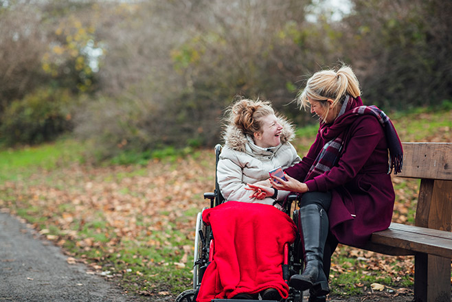 Two women sitting outside talking