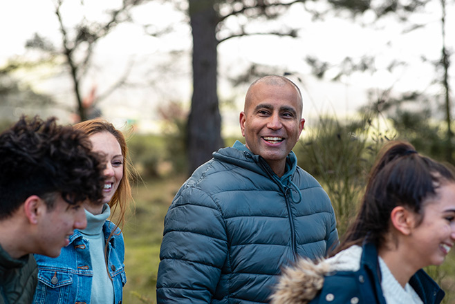 Group of friends smiling in a park
