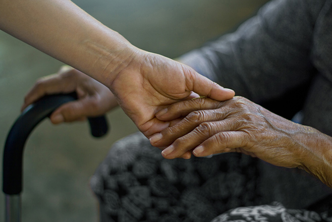 Two people holding hands