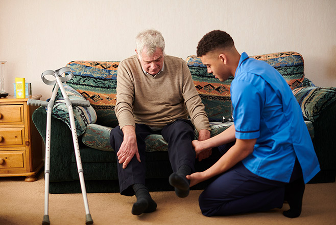 A nurse assisting an elderly patient