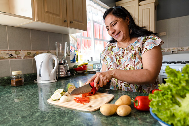 A woman chopping vegetables