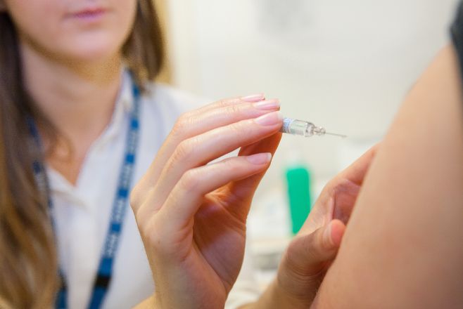 Woman receiving a flu vaccine