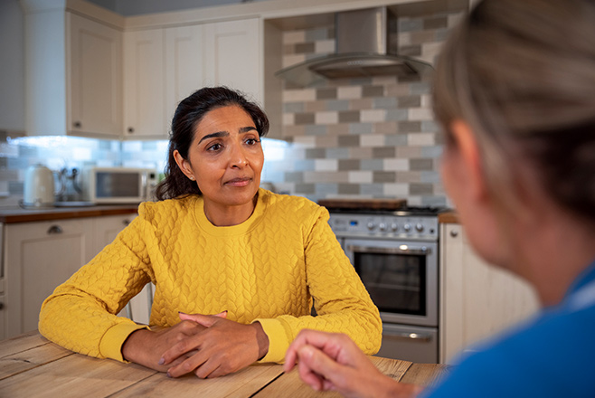 Two women talking at a table