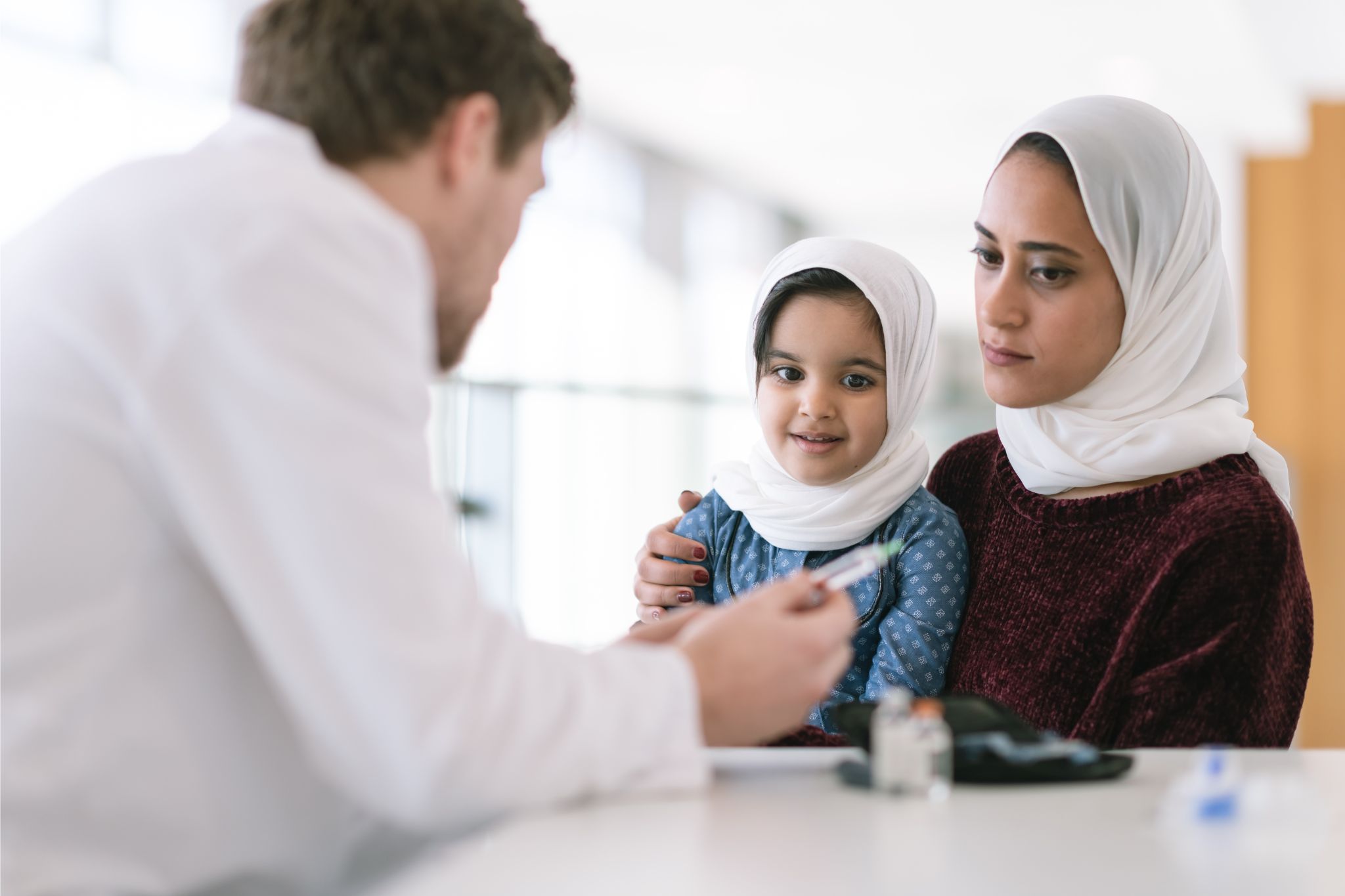 Equality diversity and inclusion Woman and child speaking with a male professional