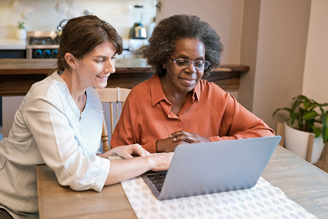 Two ladies at a laptop