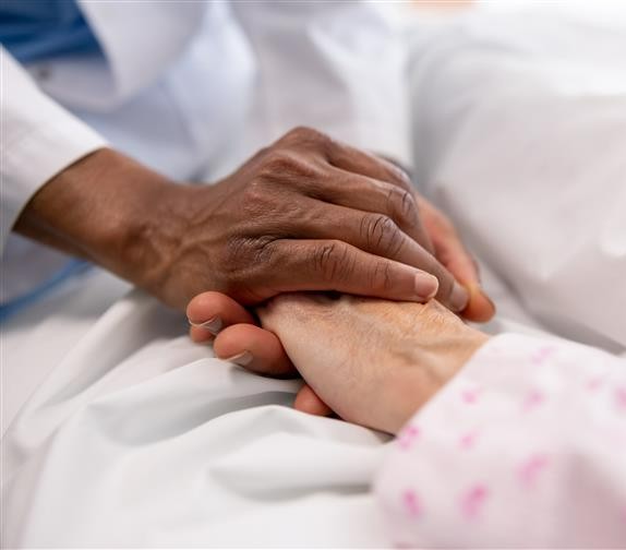 Compassionate care around dying - holding hands