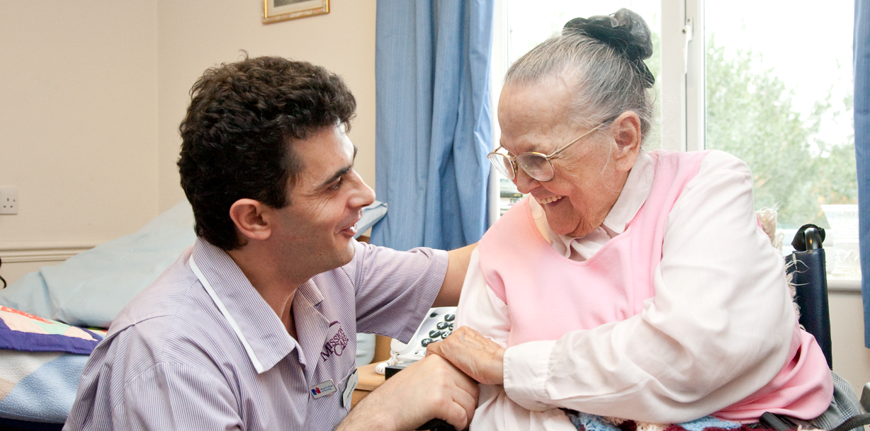 Carer chatting with resident