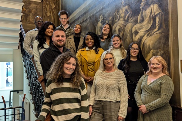 12 members of the Students Committee standing on a staircase at RCN HQ