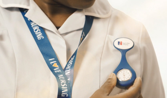 close-up of nurse looking at their RCN branded watch fob