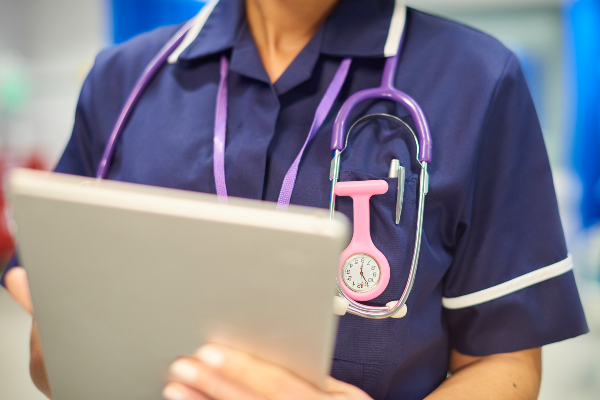 Image of nurse holding a document