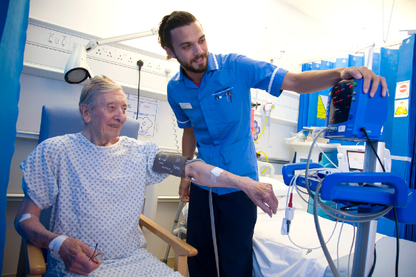 Image of nurse running tests on a patient