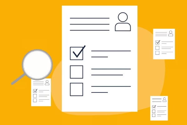 Image of magnifying glass next to important documents on a yellow background