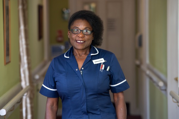 Clinical lead nurse Beatrice Kasase smiling