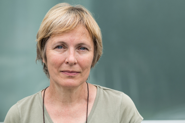 Image of a middle-aged blonde woman looking to camera