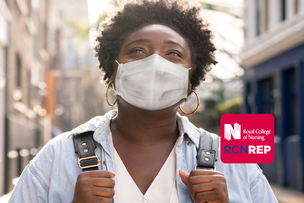 Picture of nurse wearing a face mask and smiling
