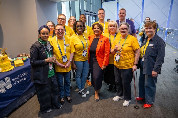 A photo of Nicola Ranger with nursing support worker members.