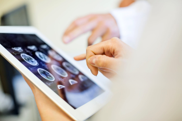 Image of a hand on a tablet