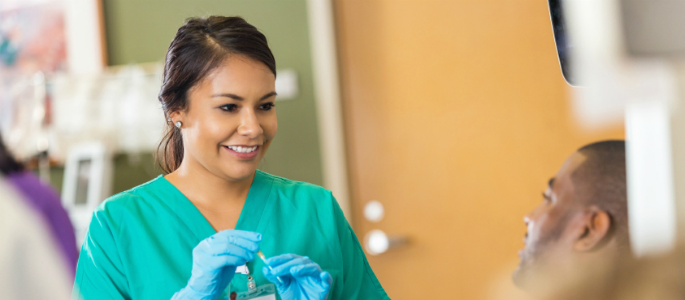 health care assistant smiling at patient