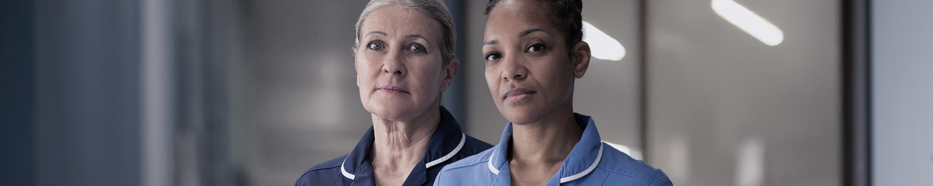 Two nurses standing beside each other