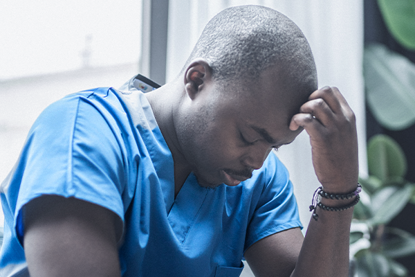 A nurse looking stressed