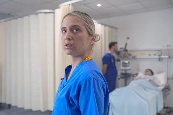 A nurse looking over her shoulder