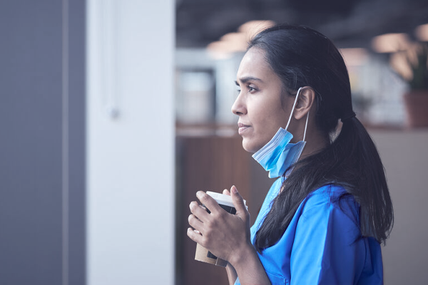A nurse with a COVID mask