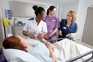 nursing staff by patient's bedside