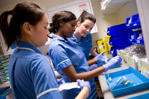 nursing staff wearing gloves