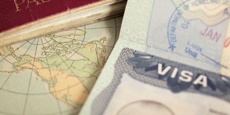 A photo of  a map, passport and visa