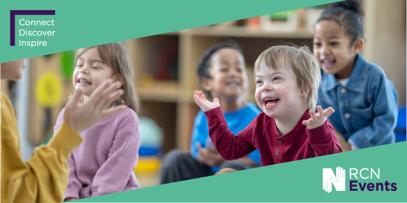 Four chlidren sat on floor looking happy from diverse backgrounds