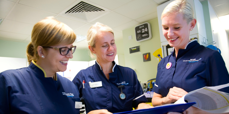 Two sisters and a clinical nurse specialist looking at paperwork 800x400 Two sisters and a clinical nurse specialist looking at paperwork 800x400
