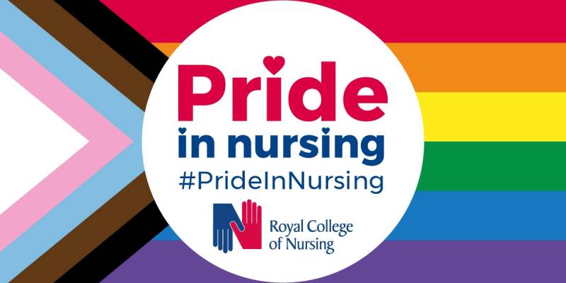 RCN Pride in Nursing logo on a rainbow and transgender / antiracist flag Pride in Nursing in red letters with a heart over the 'i' written in a white circle with the hashtag #PrideInNursing in navy blue above the RCN logo - all in a rectangle containing the Pride rainbow on the right and the transgender baby blue and pink and the anti-racist brown and black colours in an arrow on the left of the rectangle