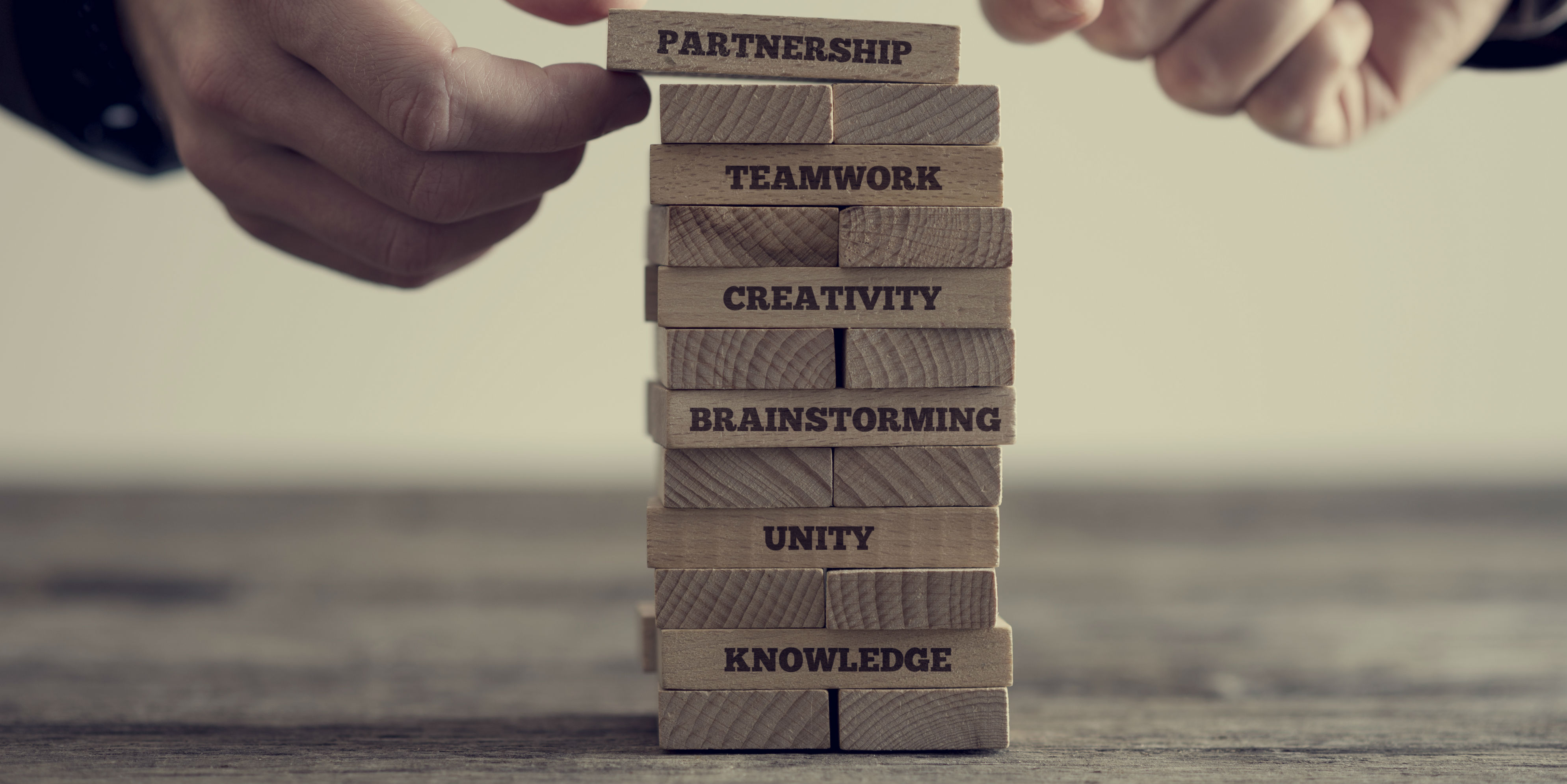 Jenga blocks with skills and inspirational words printed on them
