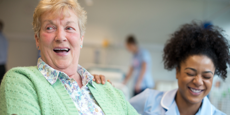 Image of a nurse laughing with a patient