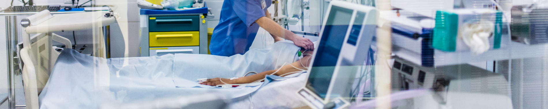 Patient in bed in ICU Patient in bed in ICU