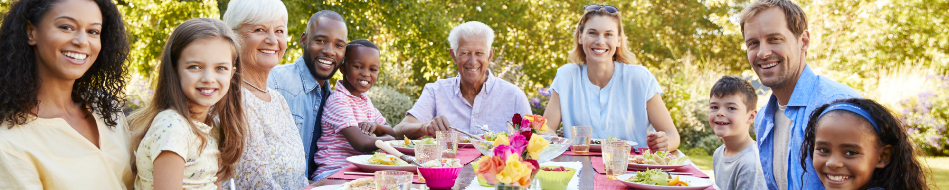 Family enjoying a meal outdoors