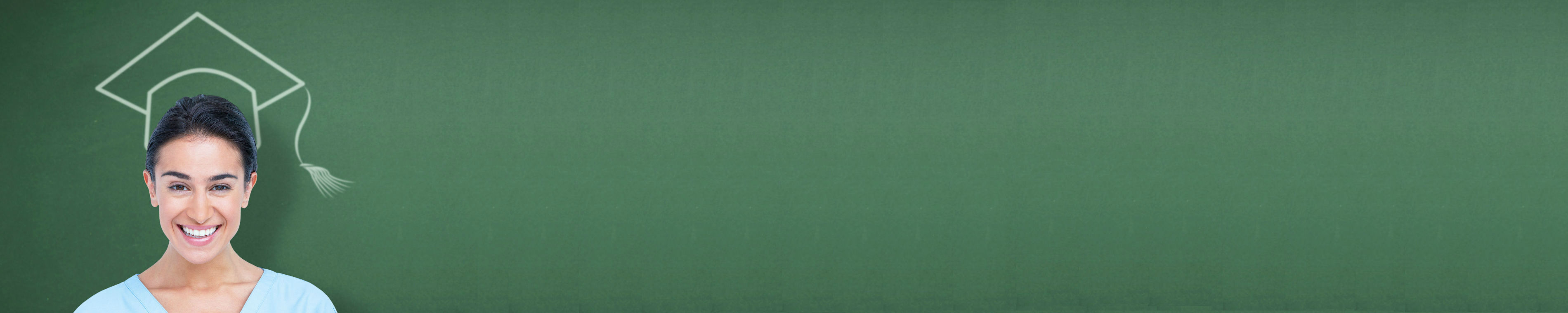 Female student standing in front of a green chalkboard with a chalk outline of a graduation hat