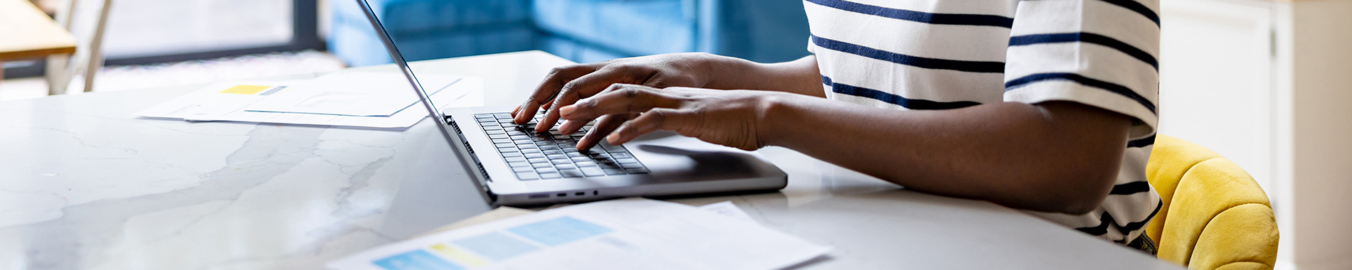 woman typing on laptop